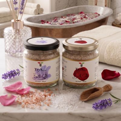 Spa salts and rose petals with bath essentials.