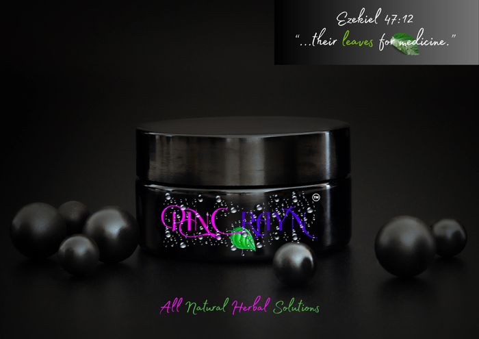 Black cosmetic jar with herbal product branding and a biblical quote about leaves for medicine.