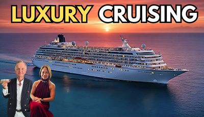 A luxury cruise ship at sunset with a well-dressed couple in front.