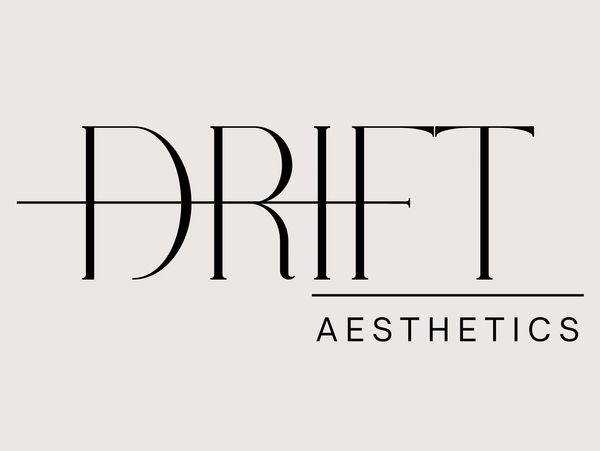 Minimalist logo with 'DRIFT' and 'AESTHETICS' in elegant font on light background.