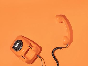 A phone on a table, representing free consultation call.