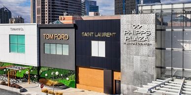 Luxury brand storefronts at Phipps Plaza in an urban setting.