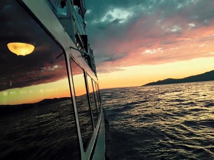 Sunset view over Lighthouse Park from M.V. Abitibi in Vancouver's outer harbour