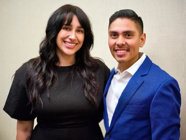 Smiling man and woman posing together.