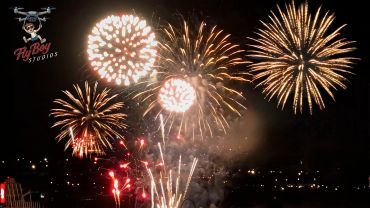 Fireworks exploding in the night sky.