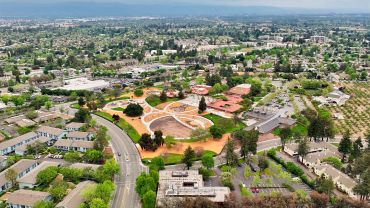 Aerial view of a suburban park and surrounding neighborhood.