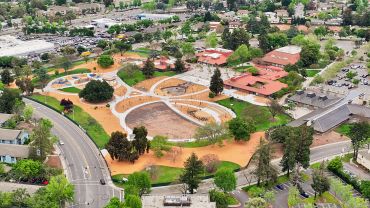 Aerial view of a park and surrounding neighborhood.