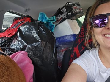 Declutter, recycle and organize. Owner taking away donations from clients house. Car is packed full!