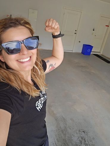 Owner smiling big and showing off muscle. Organize project complete!