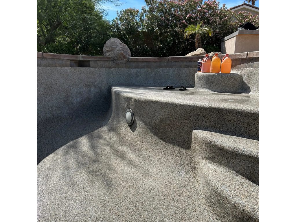 Pool acid wash on a pebble flooring.
