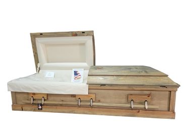 A golden pine casket with a white background