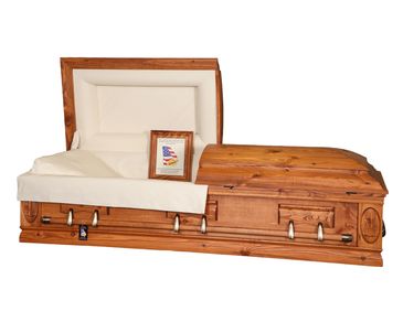 A casket with a rustic red finish with a white background
