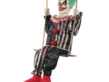 Animated Halloween prop clown swinging on a swing.