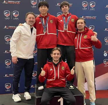 GSFA coaches with fencers with medals.
