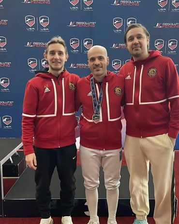Coaches Alex and Anton with fencer at nationals.