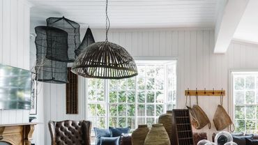 Residential Addiction Rehab - Cozy living room with leather sofas and large windows natural light.