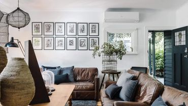 Reset Recovery Clinic Addiction Rehab's patient lounge with leather sofas and blue cushions,