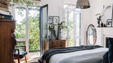 Reset Recovery Clinic Addiction Rehab - Bright bedroom with open doors leading to a lush garden.