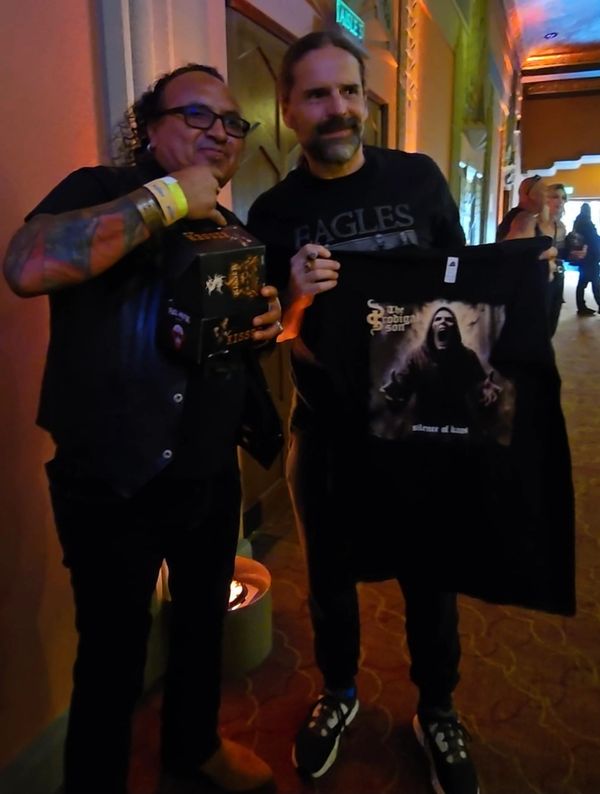 With Andreas Kisser getting guitar pedal signed while giving him Merch