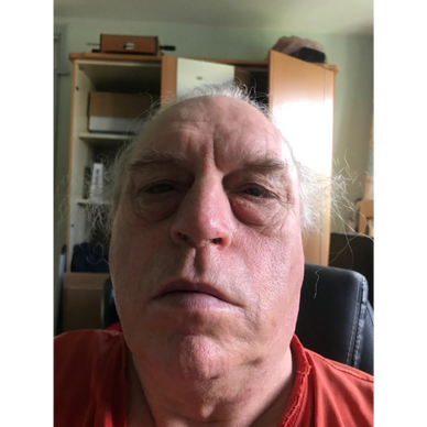 Headshot facing directly into camera.