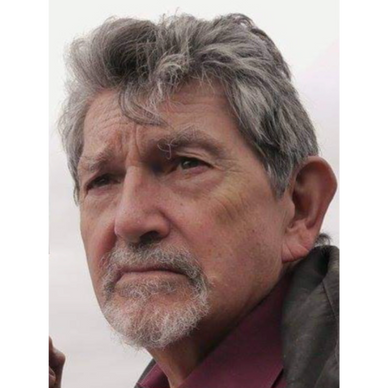 Head shot with the view seeming to be looking over the photographers left shoulder