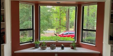 Interior residential painters helped make the reading nook more cozy,