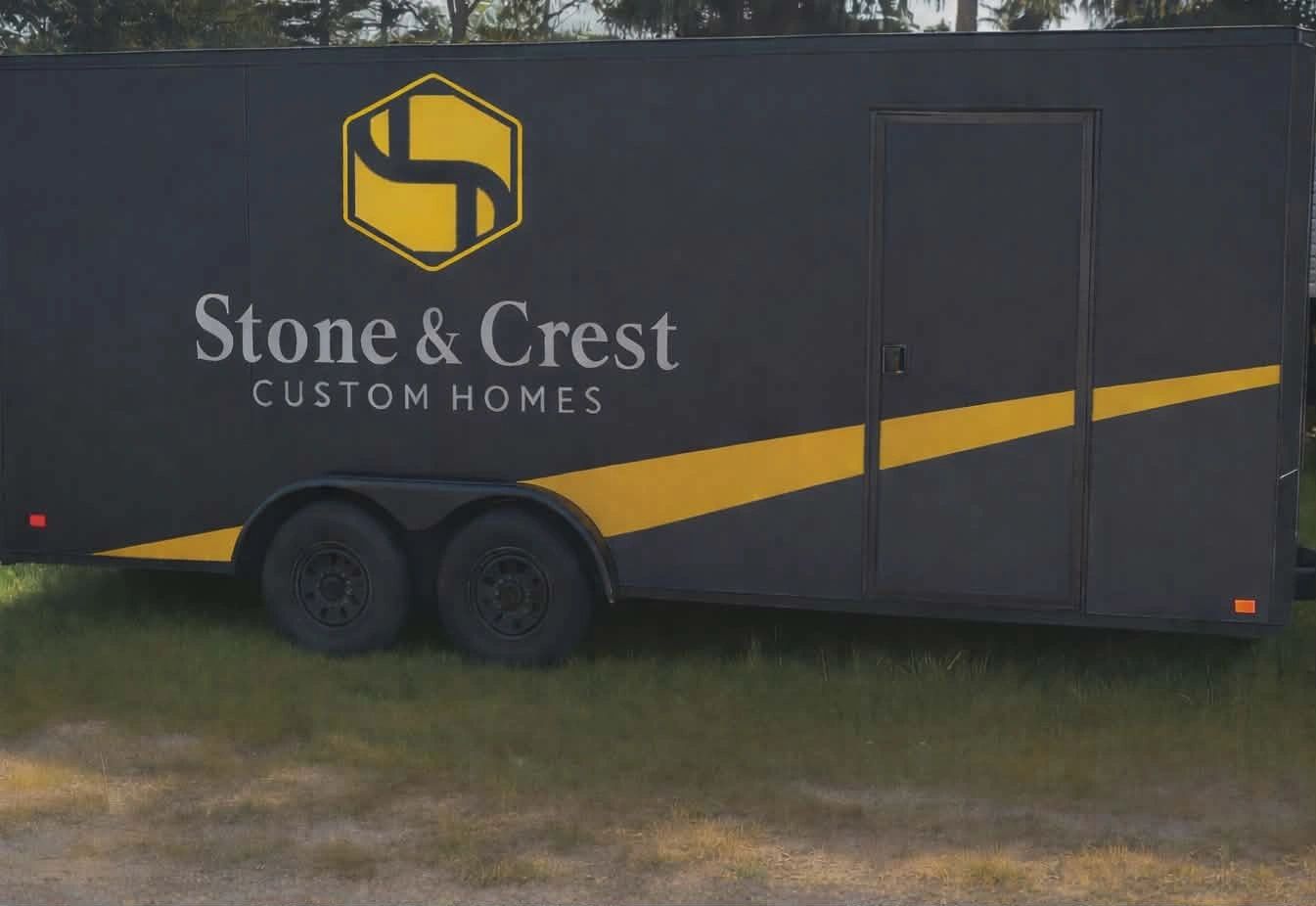 Black trailer with yellow stripe and Stone & Crest Custom Homes branding.