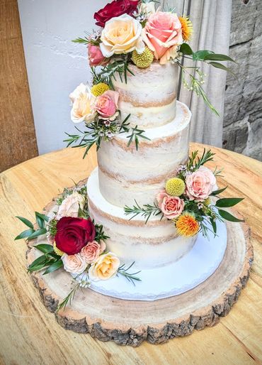 Stunning semi naked wedding cake with roses