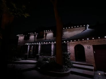 Kleinburg house with clean white LED soffit lighting installed for a modern nighttime look.