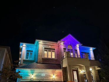 Woodbridge home with permanent LED lights in blue, purple, and teal by Toronto Glow.