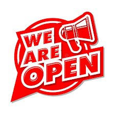 Red sign with megaphone stating 'We Are Open'.