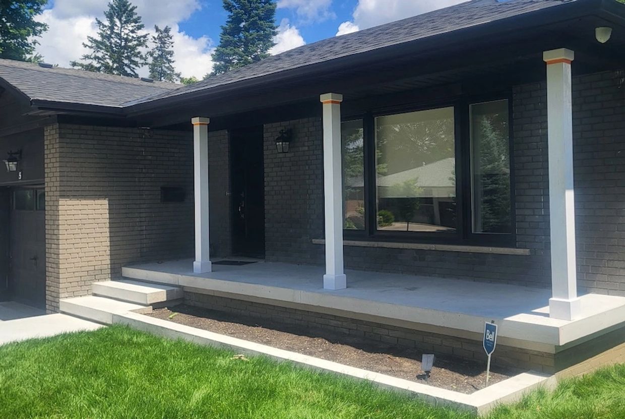 6 inch Square FIbreglass Columns installed on porch with black accents