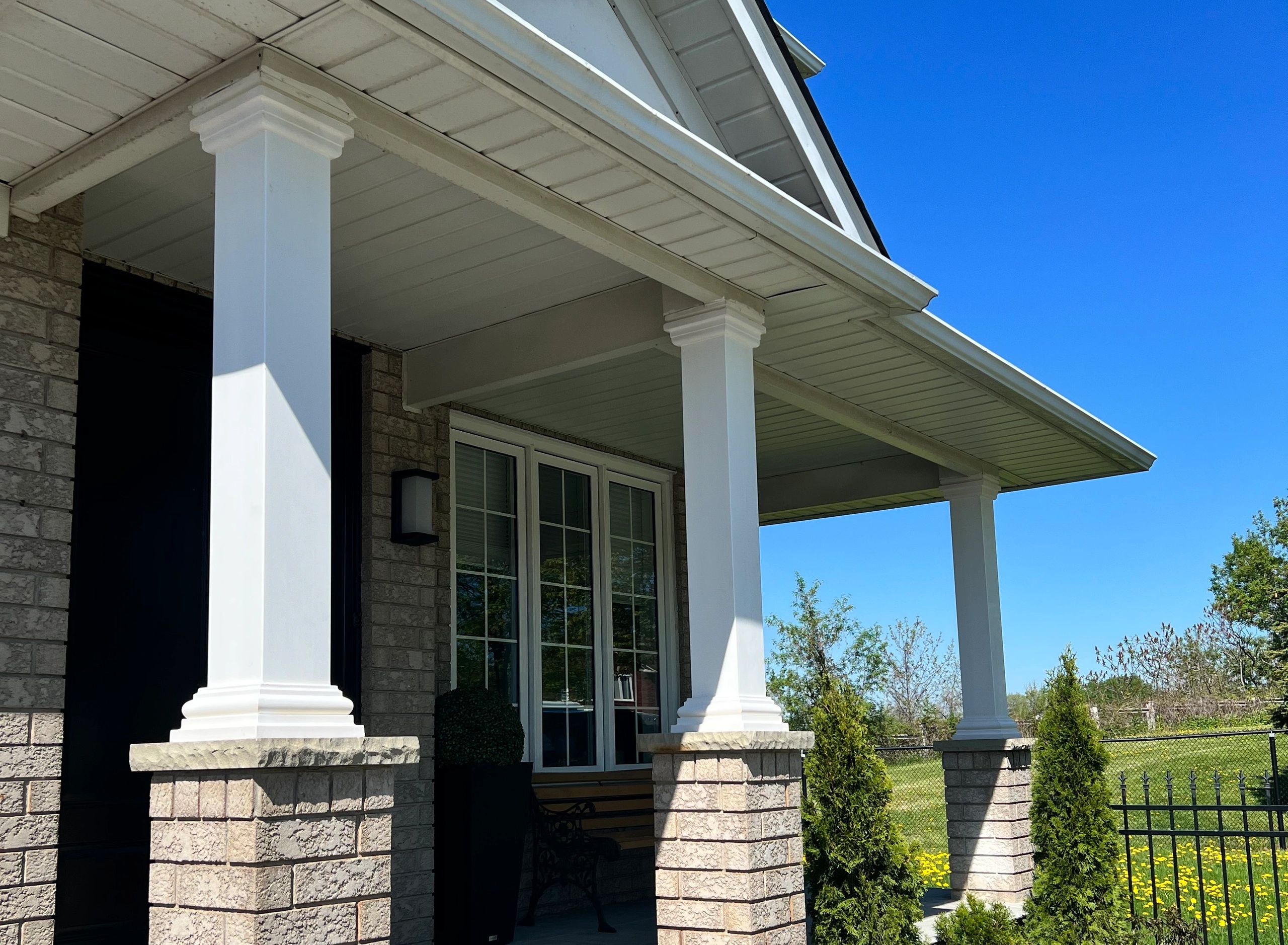 Square Fibreglass Columns installed on Brick Pedestals in front porch of house.