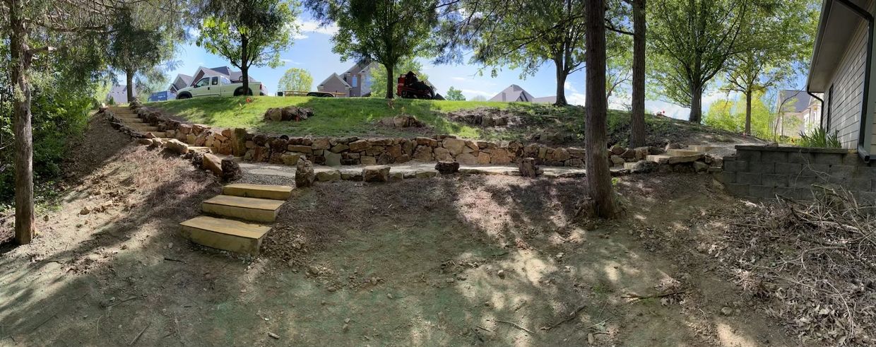 Finished natural stone retaining wall in Simpsonville, KY.