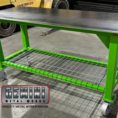 Standard duty rolling work table designed and built by Gemini Metal Works with heavy duty steel cast