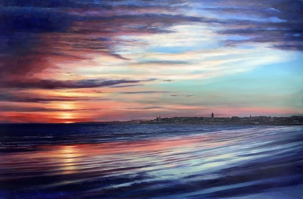 St Andrews at dawn. Morning light from West Sands, St Andrews.