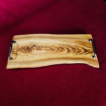 Charcuterie and serving board crafted from premium Mediterranean olive wood.