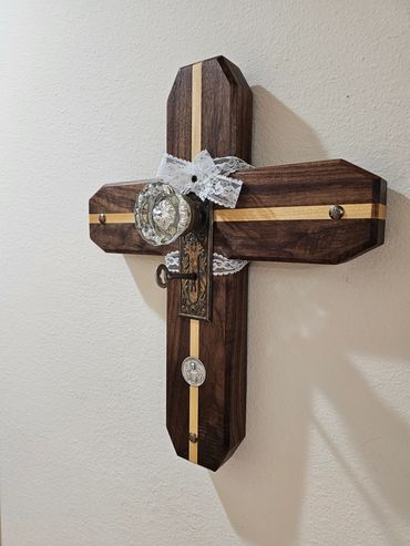 Walnut and yellowheart cross with vintage 19th-century doorknob, key, and lace details.