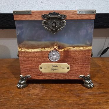 Urn crafted from mesquite wood, epoxy resin, and Spanish cedar, designed for both humans and pets.