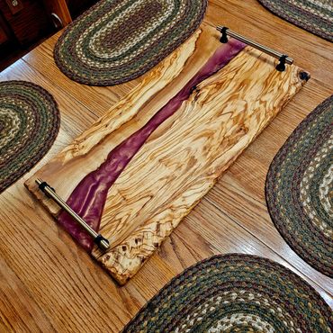 Charcuterie and serving board, meticulously handcrafted from premium Mediterranean olive wood.