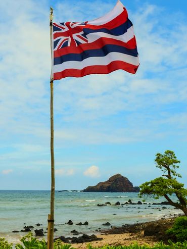 Hawaiian Flag flying in the wind. Hawaiian Fire. God's Kingdom.