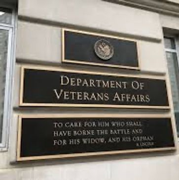 Signboard of the Department of Veterans Affairs on a building wall.