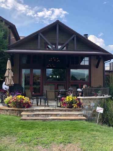 Dark wood house with a spacious deck