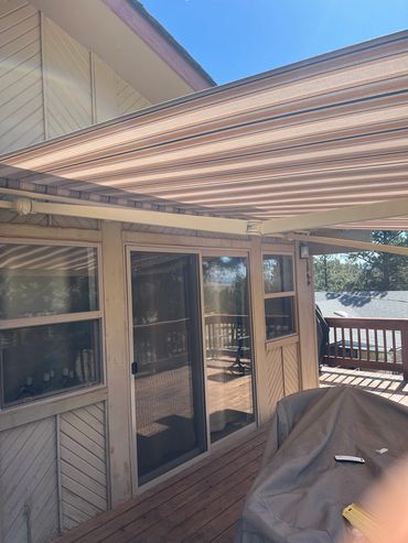 Outdoor deck under a solid roof awning