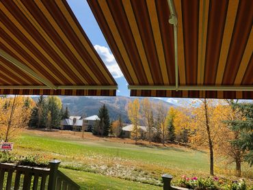 Yellow and red striped deck awning