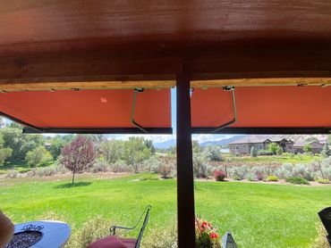 Wooden deck with large covered patio