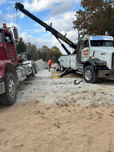 Scott’s Towing team performing heavy-duty recovery with wreckers at a job site near Hannibal, MO.