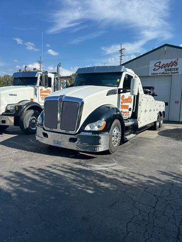 Scott’s Towing trucks parked at the Hannibal, MO shop, ready for towing and recovery service.
