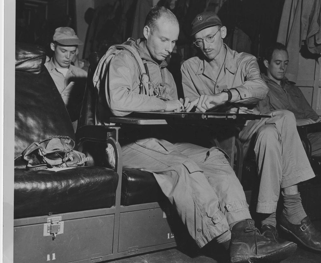 RT reviewing war plans in flight before landing.