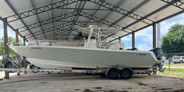 Side view of boat with second station under pole barn